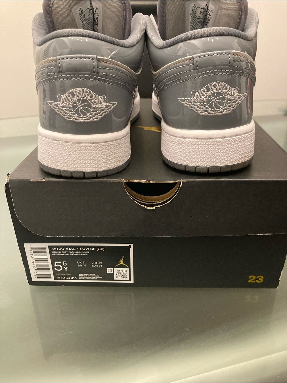 Jordan Air Jordan 1 Low SE Kids Sneakers in Gray and White